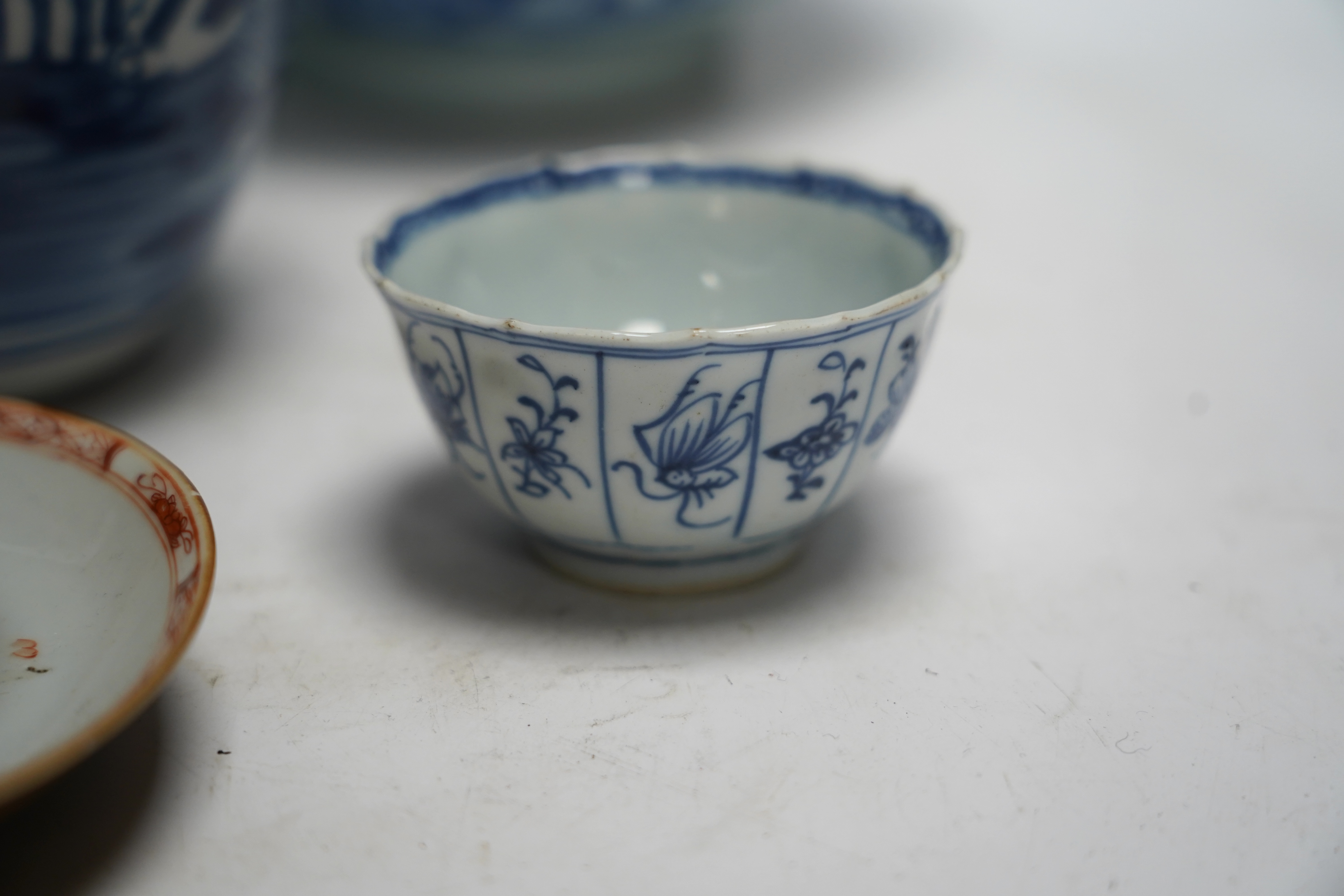 A group of 18th century Chinese and Japanese porcelain including blue and white bowls and jar with hardwood cover, largest 19cm in diameter